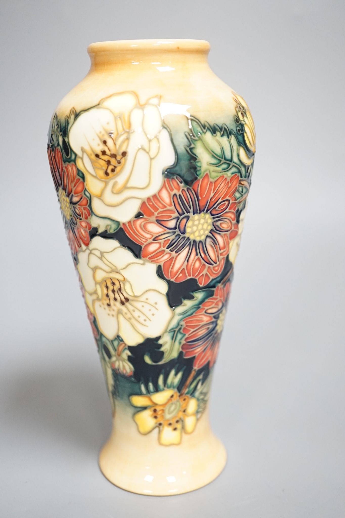 A Moorcroft vase, multi floral designed, signed E Bossons, 20.5 cms high.